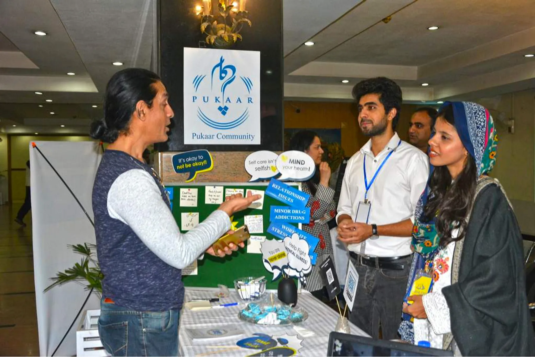 Volunteers at a Pukaar stall